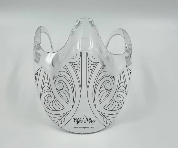 Large plastic face shield with tribal design printed on it